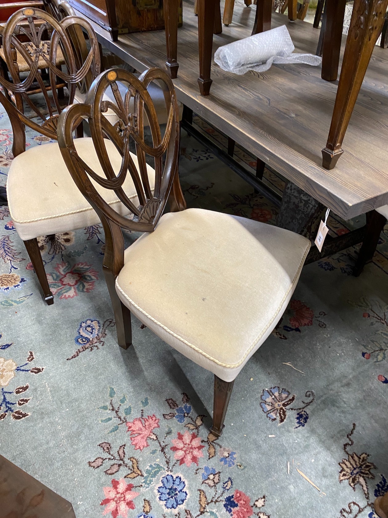 A set of eight Hepplewhite style mahogany dining chairs, two with arms